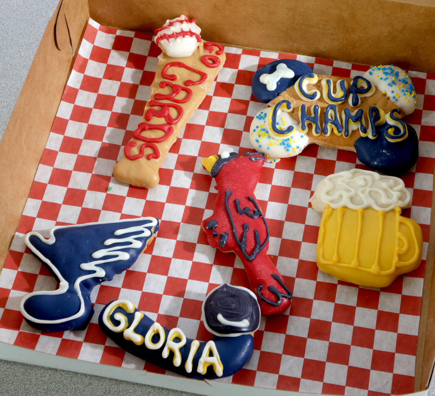 Sports-themed decorated dog cookies